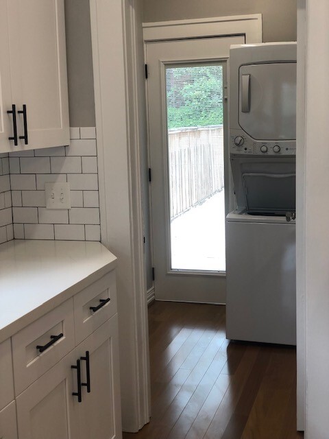 mudroom area with stackable washer and dryer (new) and tankless hot water heater - 1742 W Main St