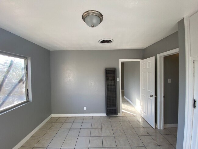 Building Photo - Hard to Find 1 BD 1 BA House with a 2 car garage and it's own yard.