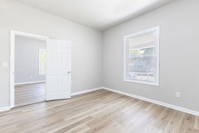 Building Photo - Remodeled 2-Bedroom Bungalow with Spacious Yard & 1-Car Basement Garage