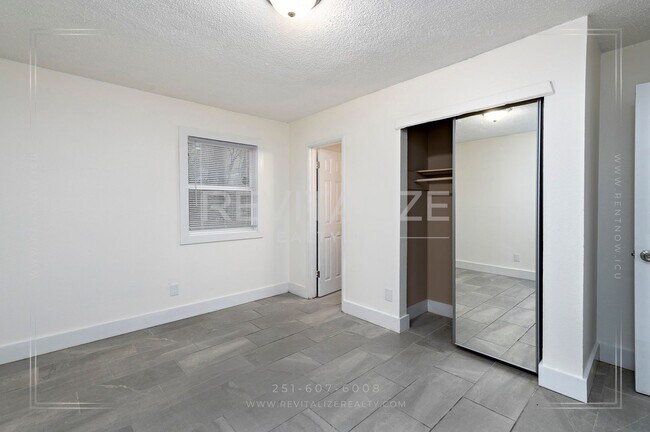 Building Photo - 3 BR 2 BA Home with Fenced Yard & Carport