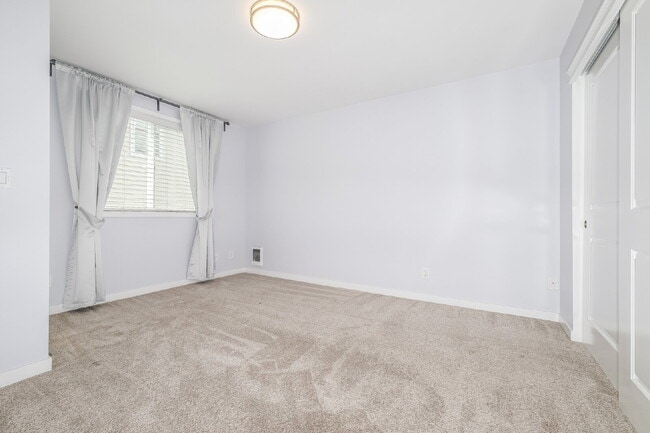 Building Photo - **Updated 2-Bedroom Condo with Secure Parking, In-Unit Laundry & Utilities Included**
