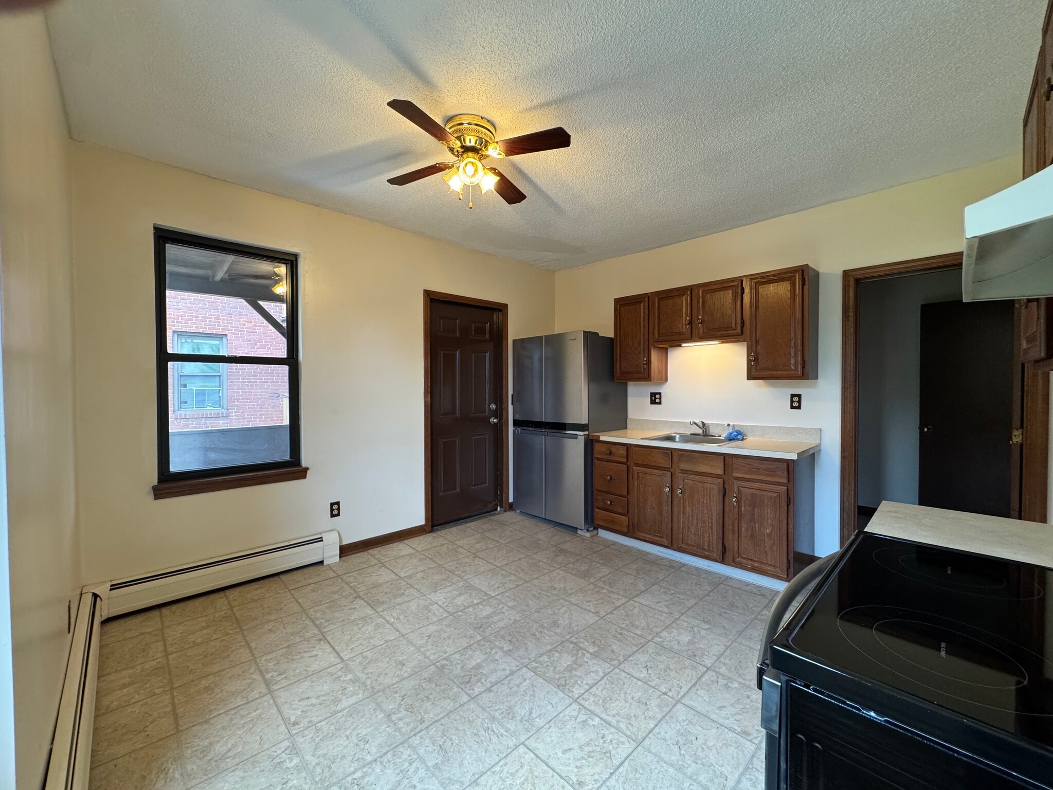 Kitchen w/ French door refrigerator - 67 E Main St