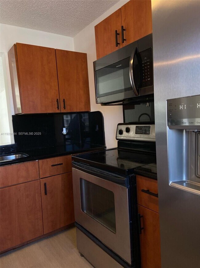 Building Photo - 8740 N Sherman Cir