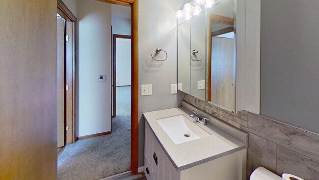 Building Photo - Updated two bedroom ranch duplex with partial basement finish, detached garage, close to mall/sho...