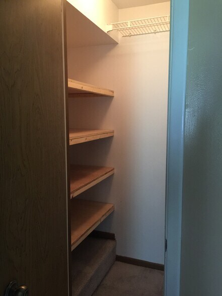 Coat Closet and Storage - Shelving made to hold 3 Storage bins across - 4912 Angelia Dr