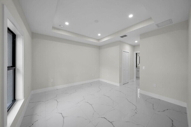 Building Photo - Brand-New Home in Lehigh Acres – Move-In Ready! FL 33974. Qualify for a deposit-free option and s...