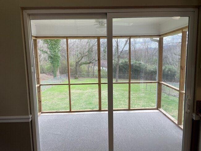 Screen porch with view of fenced yard - 198 Culver St