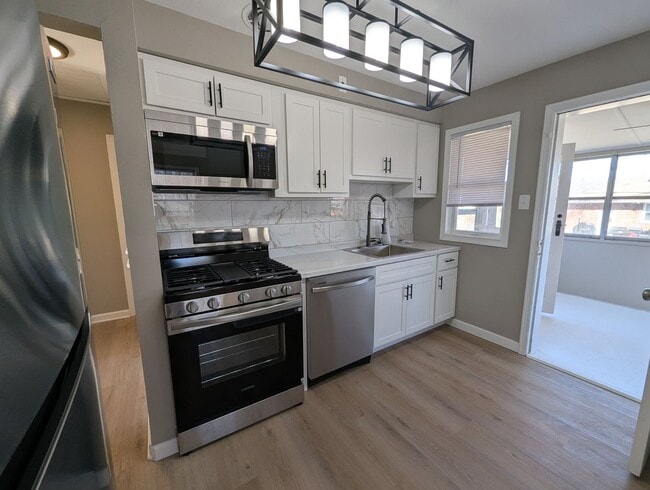 Building Photo - Fully Renovated Home with Sunroom, Garage & Huge Fenced Yard