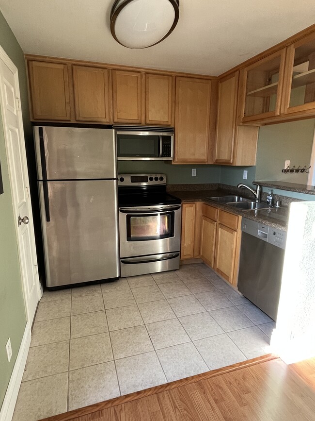 Kitchen with stainless steel appliances - 8731 Graves Ave