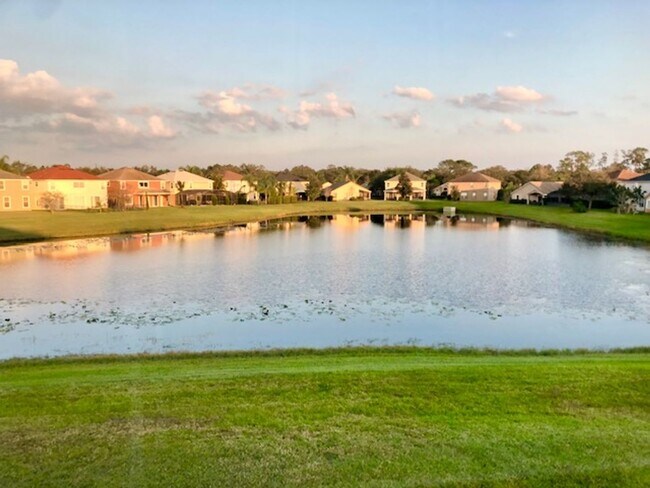 Building Photo - EAGLE CREEK LAKE NONA! WELCOME HOME! Beautiful water views! Spacious 2 story-3 bedroom 2.5 bath h...