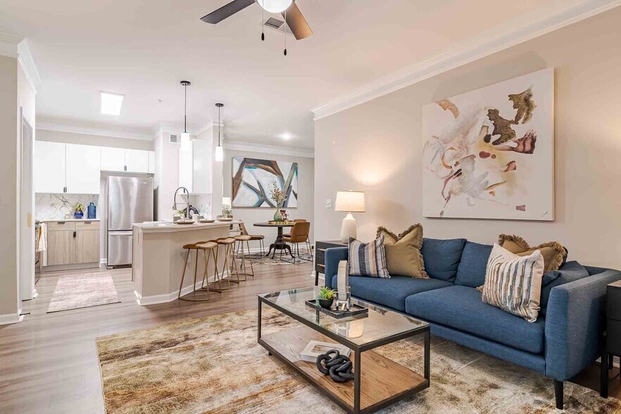 Newly Renovated Living Room and Kitchen with Breakfast Bar - Waterstone at Big Creek Apartments