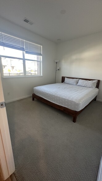 Bedroom and ensuite bath on Lower Level - 6964 Merseyside Ln