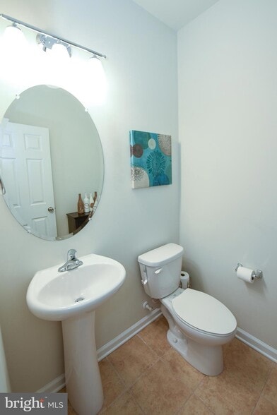 Convenient half bath located just off the main living area — perfect for guests - 1736 Beacon Ln