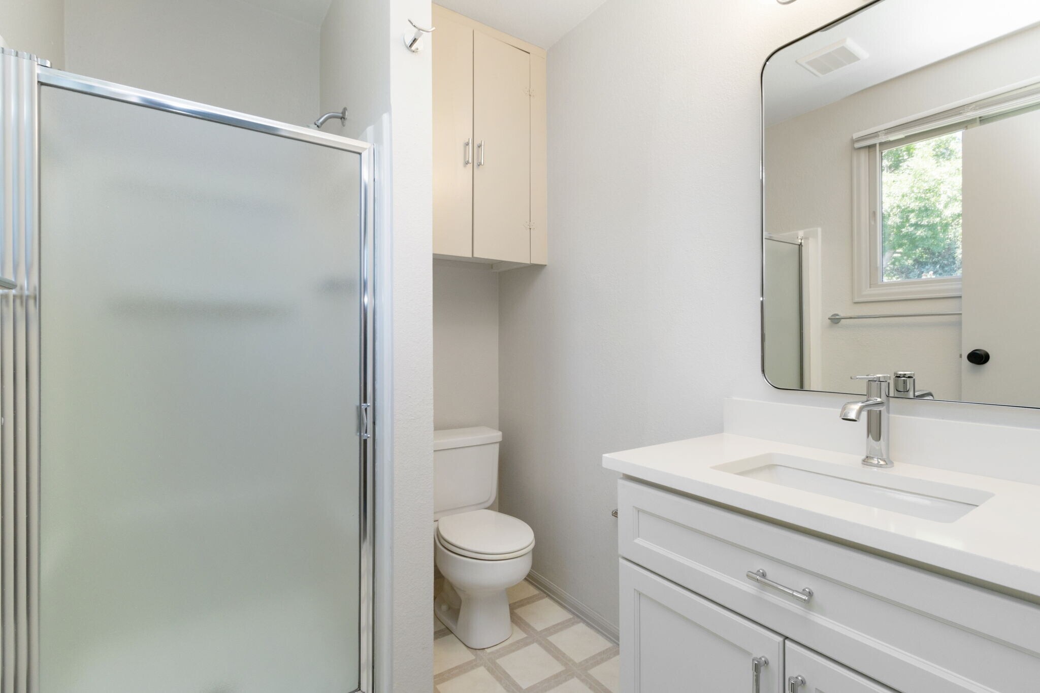 Updated, private bathroom attached to primary bedroom. - 1956 Promenade Way