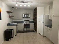 Building Photo - Quiet Corner Unit in Condo Complex