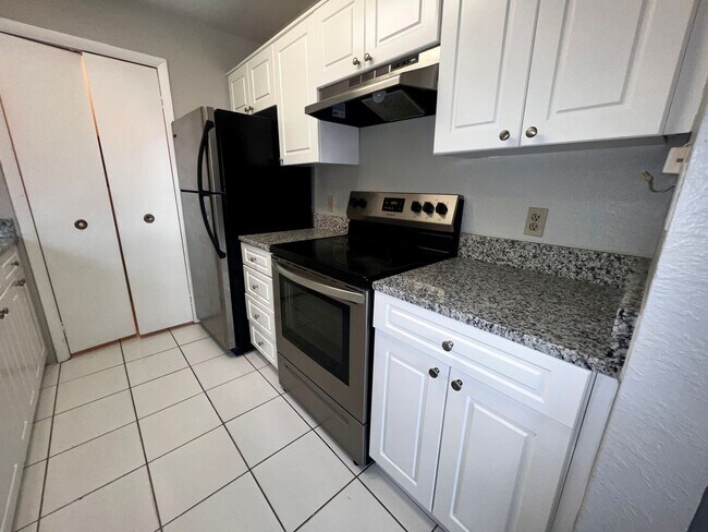 Building Photo - 3/2 Regency Gardens 1st Floor Condo with New Plank Fooring, Stainless Appliances, and Fresh Paint!