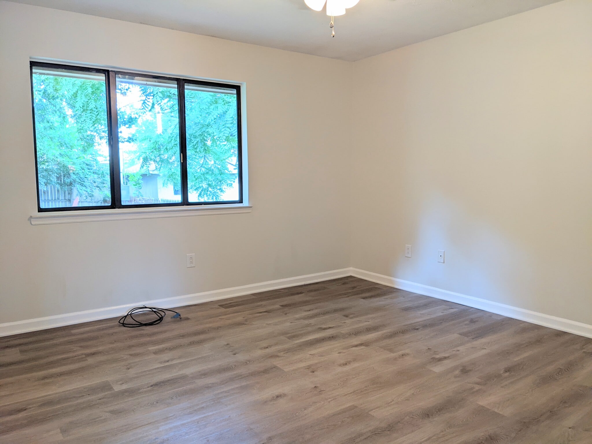 Main Bedroom with large window overlooking backyard - 1649 Summerhill Dr
