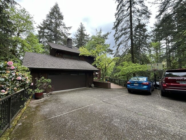 Building Photo - One-of-a-Kind Custom Home with Wall of Windows, Stone Fireplaces, Expansive Entertainment Space &...