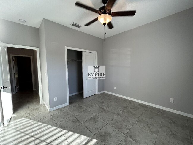 Building Photo - COMING SOON! 3 Beds + Den, 2 Baths, Screened Lanai & More!