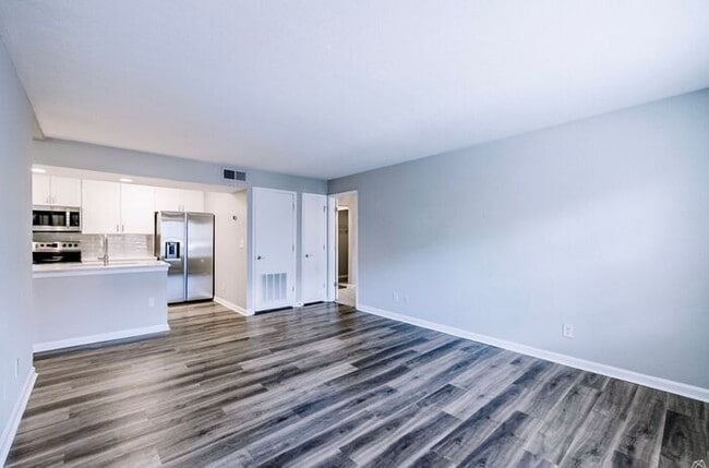Building Photo - Spacious 2-Bedroom Elite Apartment with Private Balconies & Washer/Dryer