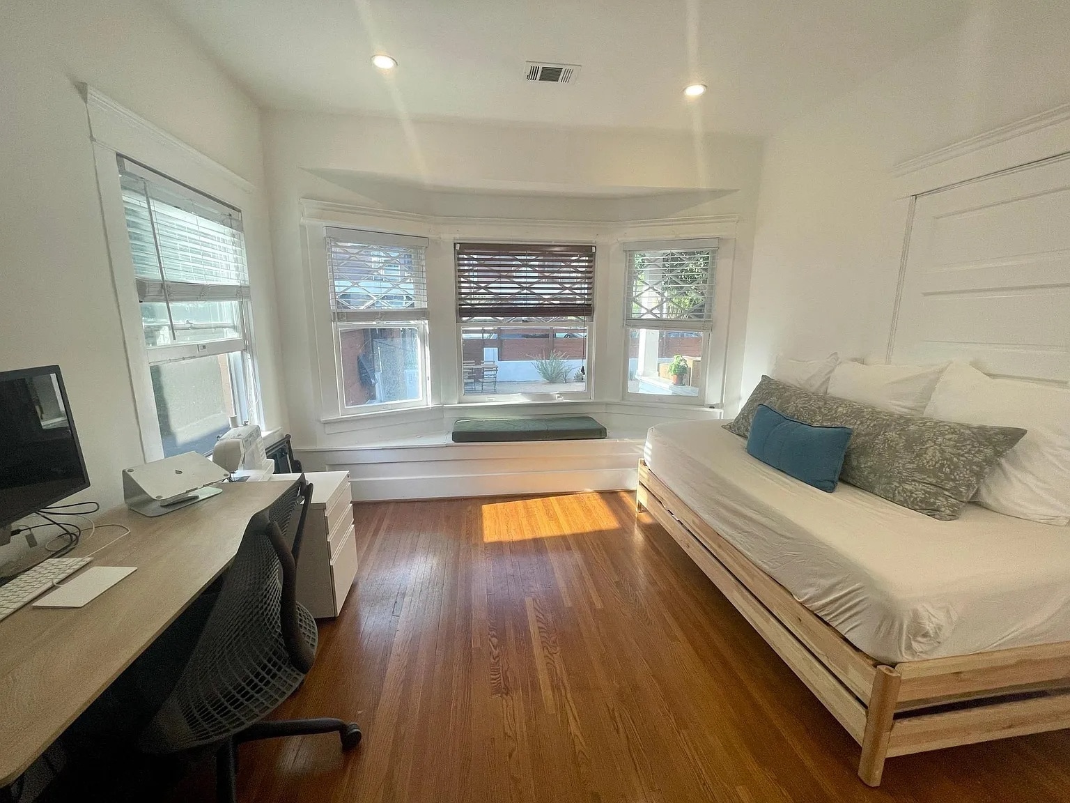 Spacious second bedroom with hardwood floors and plenty of natural light. - 6000 Carlton Way