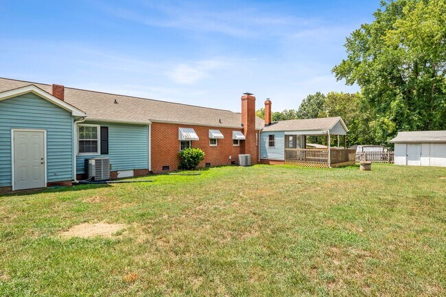 Building Photo - Large Renovated Ranch Home, Two Kitchens & Two Living Areas, Hardwood Flooring, Deck, Fenced!