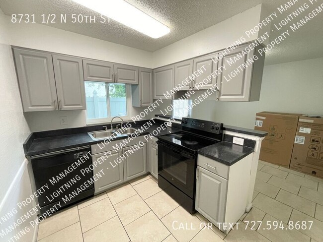 Building Photo - 8731 1/2 N 50th St-H