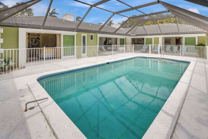 Salt water pool with metal enclosure for child safety - 1350 Spanish River Rd