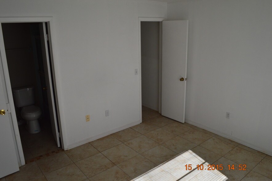 Guest bedroom/view of closet and bathroom - 12373 Shafton Rd