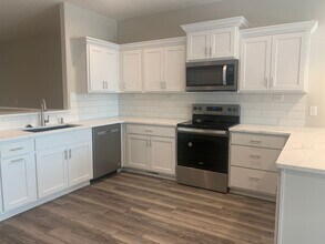 Building Photo - Walkout ranch townhome with 2 stall garage. Spacious 2 bedrooms with walk in closets, 2.5 bathroo...