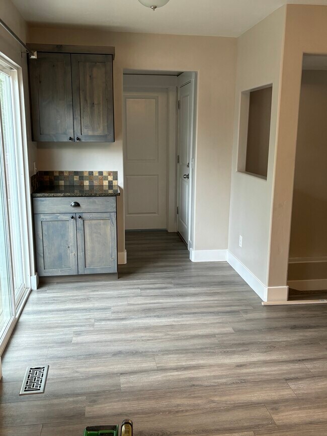Dining Area and hall to Coat Closet, Garage entry door, and Laundry Room - 363 Royal Troon Dr