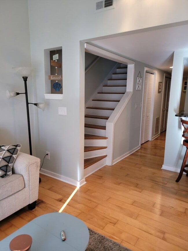 Building Photo - Located in Caneel Cove this 2 bed 2 bath townhome features hardwood floors throughout ,