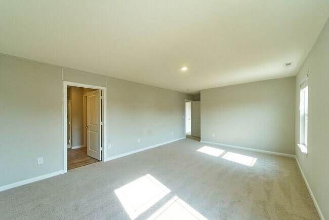 Building Photo - 4 Bedroom at Trotter's Landing in Camby With Pond View!