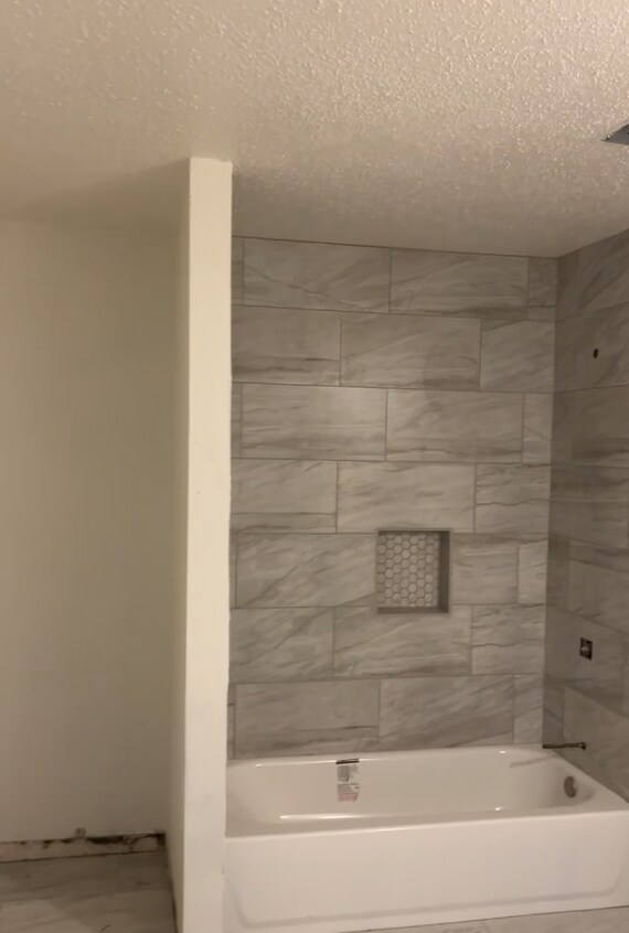 Close-up look at the beautiful tile and encove for convenience access to toiletries. - 4720 Burma Rd