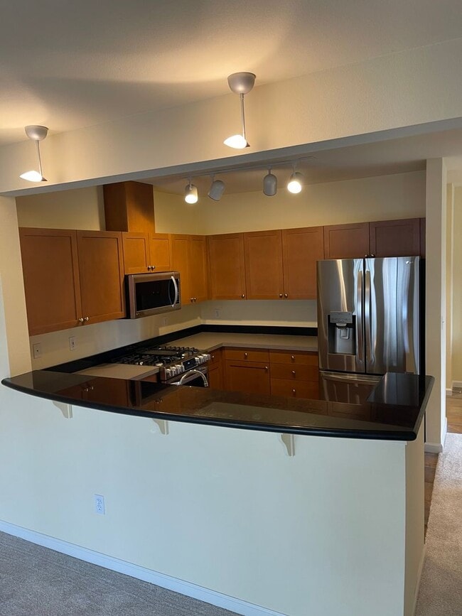 Building Photo - Updated Condo with Parking for One, Great Location and Communal Roof-top Deck!!