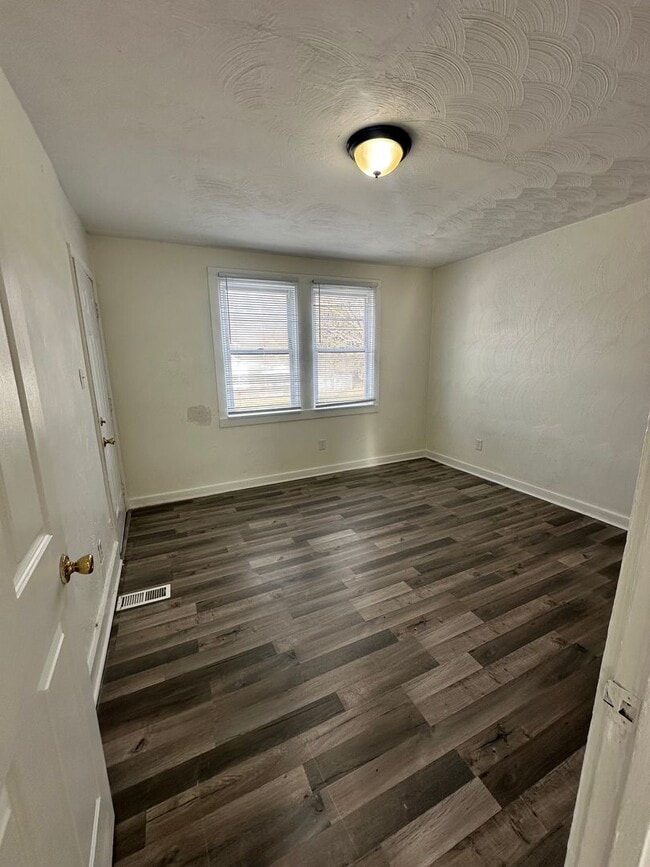 Building Photo - Three Bedroom Available Soon!