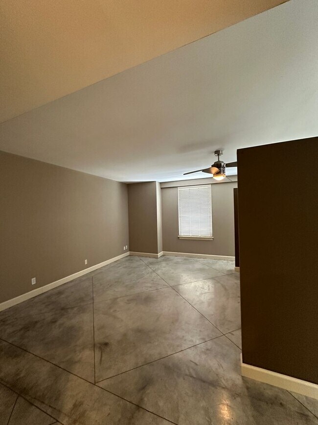 Building Photo - INCLUDES GARAGE PARKING AND INDOOR POOL! 1...