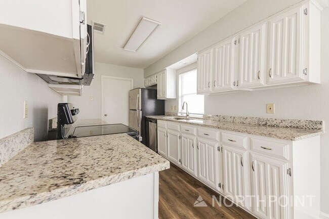 Building Photo - 3 BR/2BA | Newly Renovated Single Family Home | Fireplace in living room | Fenced backyard!