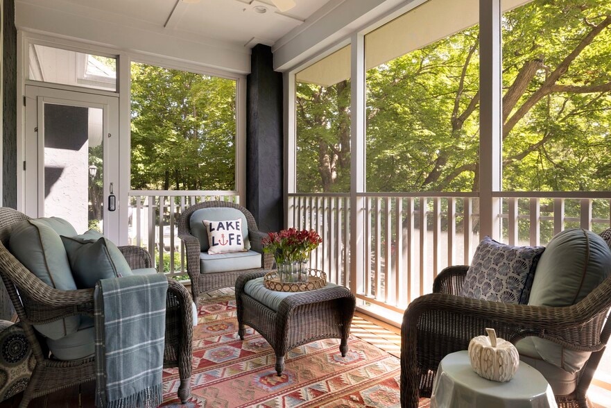 Step out from the kitchen and informal dining room onto your private screened-in porch - 745 Rice St E