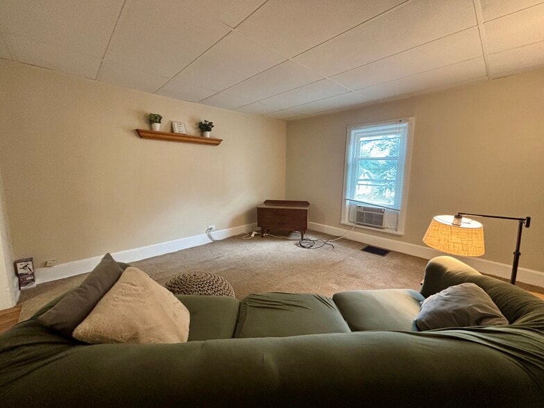 Living room. - 606 Dewey Ave