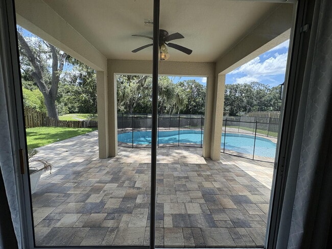 Building Photo - Spacious 5-Bedroom Pool Home with Putting ...