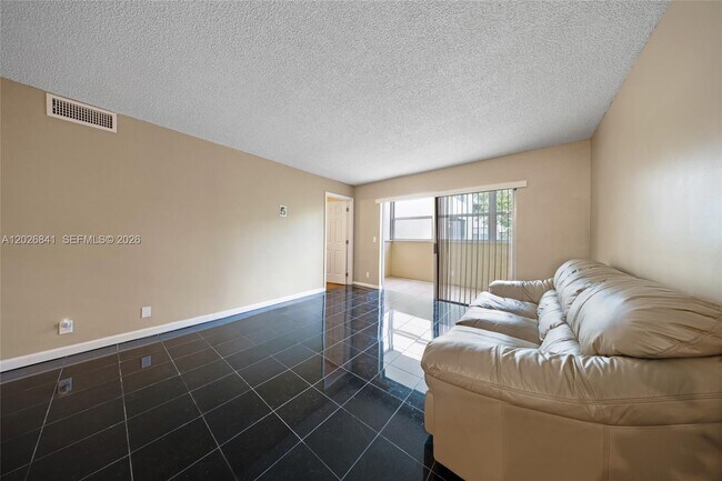 Building Photo - 6075 N Sabal Palm Blvd