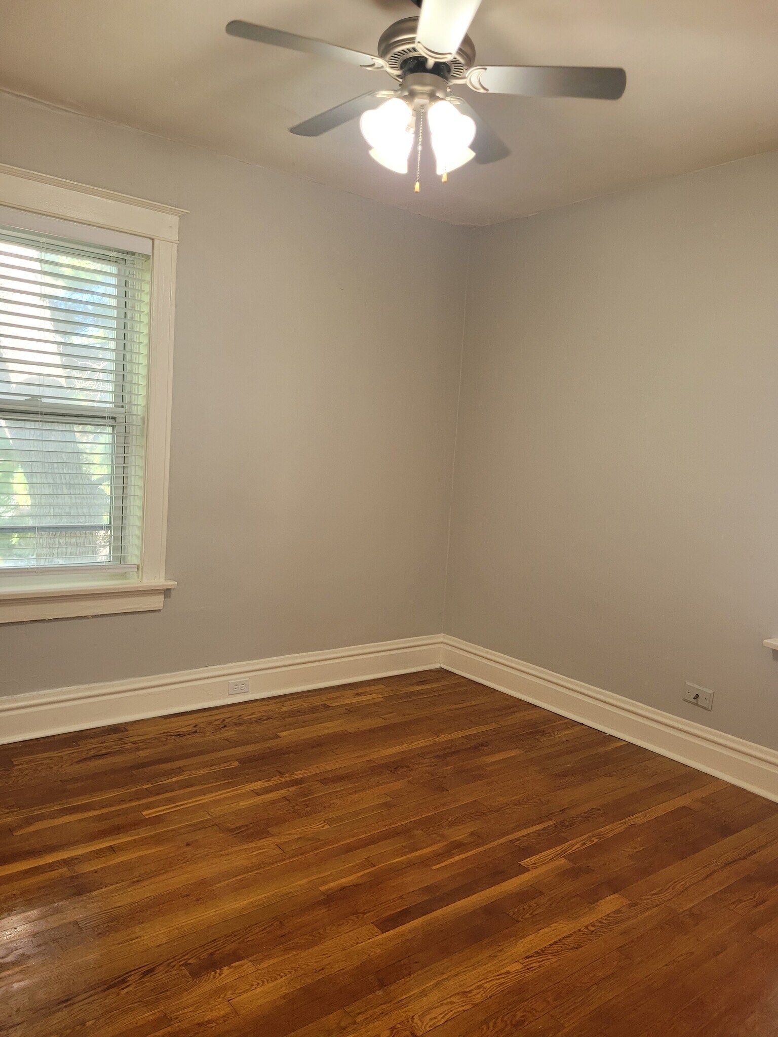 The bedroom is located in the rear of the unit. - 2055 Alfred Ave
