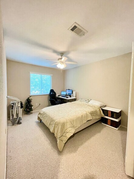 Bedroom #2, fits a full/queen size bed with a desk and a chair - 8263 Wednesbury Ln