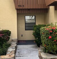 Building Photo - Two-story condominium, featuring 2 bedrooms and 2 1/2 bathrooms