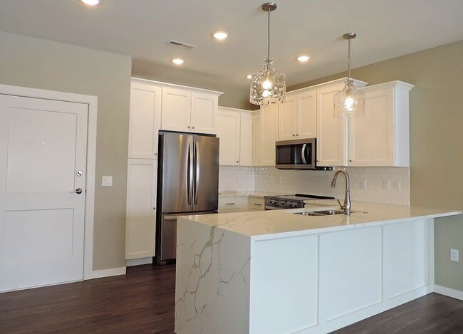 Building Photo - LUXURY CONDO - AVAILABLE NOW - MOVE IN PROMO