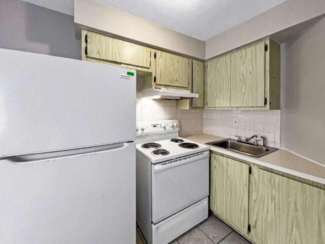 Building Photo - Budget-Friendly. Bold Personality. Big Coz...