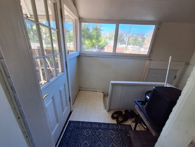 Back of kitchen looking out to backyard and stairwell to basement - 293 South Lafayette Street