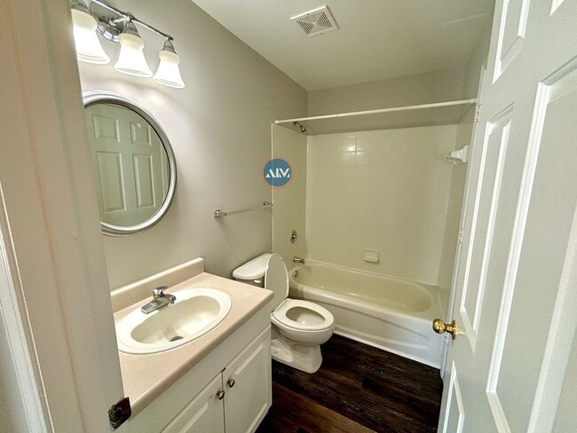 Building Photo - Modern 3-Bed Condo: Lovely Appliances, LVP...