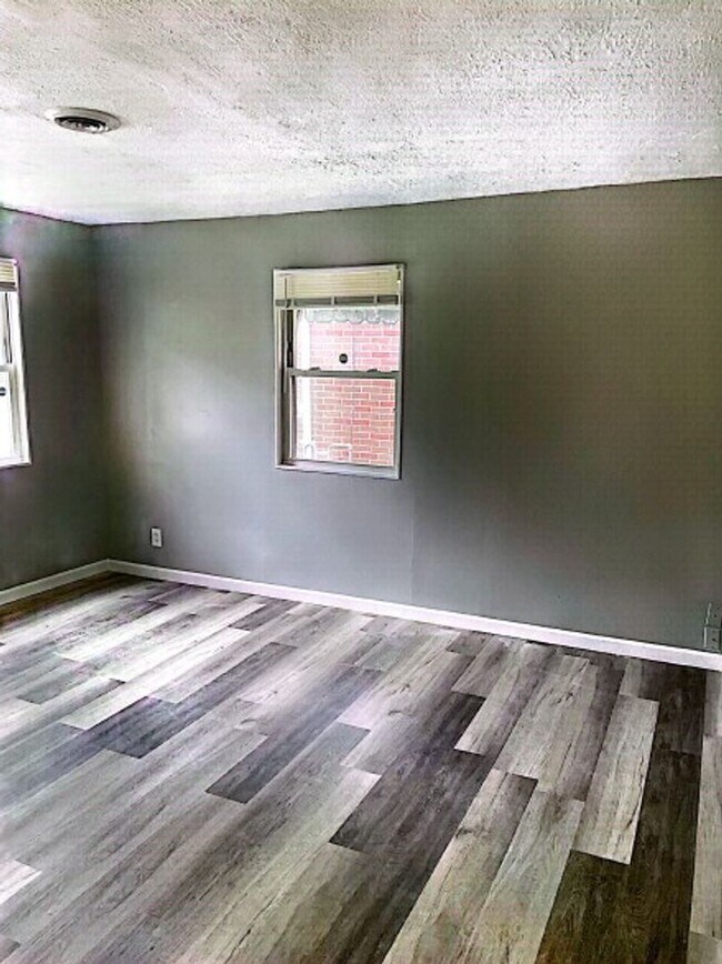 Building Photo - Available now! Great 2 bedroom with AC and detached garage!